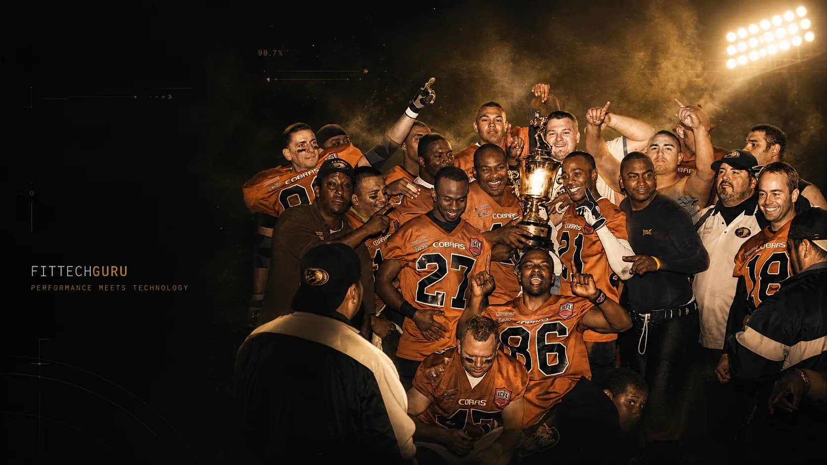 A team lifting the trophy together under the lights — the moment FitTechGuru builds toward.