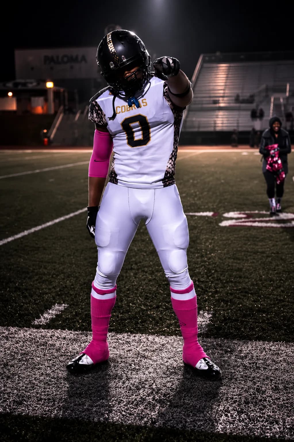 A player pointing to the stands after the play — game-day intensity, FitTechGuru-styled.