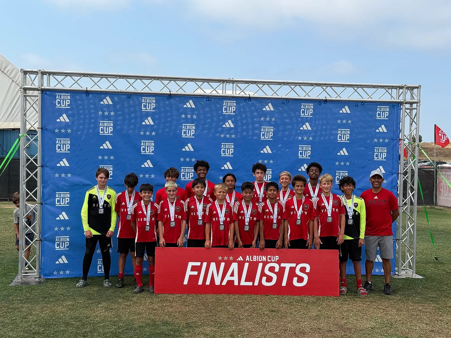 A youth team celebrating together as Albion Cup finalists.